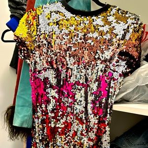 Cute and sexy sequins dress that can be used as a top with boots or jeans.